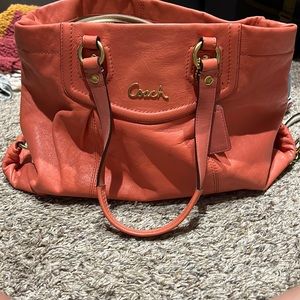 Coach coral colored bag. Like new. No marks beautiful conduction with wristlet.
